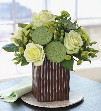 lotus pod bouquet in bamboo grove vase