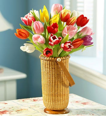 multicolored tulips in rattan vase