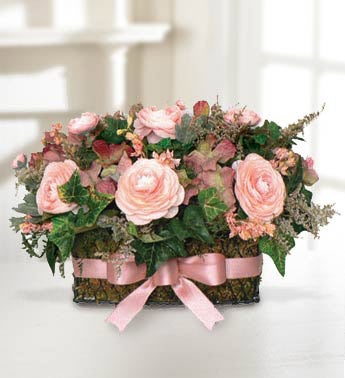 preserved pink arrangement in wire basket
