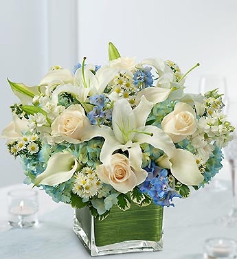  are married in this centerpiece of white roses white mini Calla lilies 